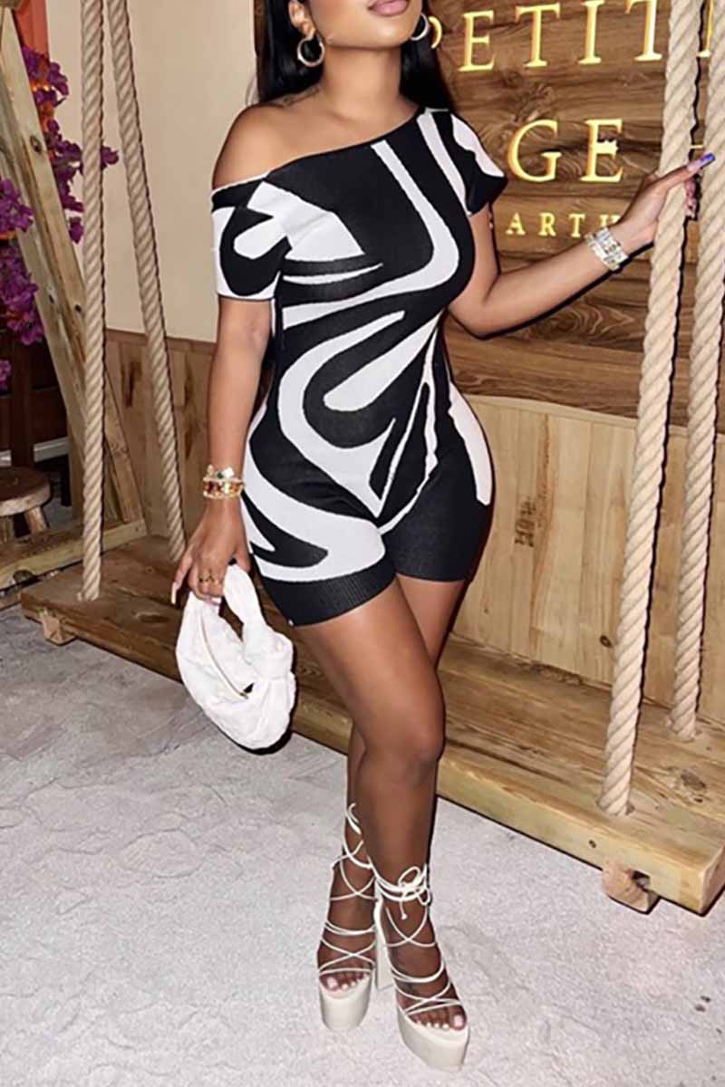 REVERSIBLE BLACK AND WHITE ZEBRA ABSTRACT ROMPER