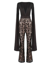 Load image into Gallery viewer, BLACK CAPE SLEEVE JUMPSUIT WITH SEQUIN TROUSER AND CONTRAST NUDE LINING
