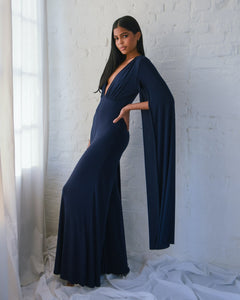 NAVY JERSEY WIDE LEG JUMPSUIT WITH CAPE SLEEVE AND OPEN BACK